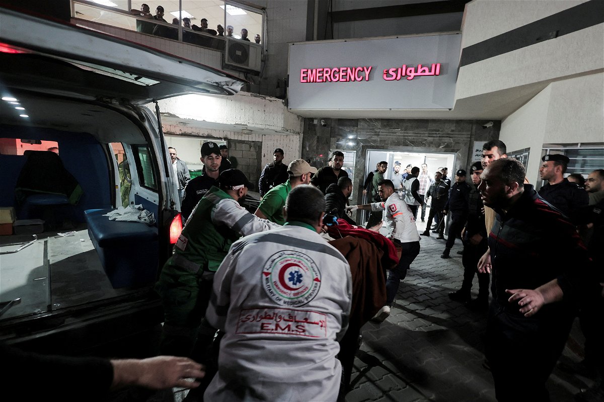 <i>Ahmed Zakot/Reuters</i><br/>Medics transport a victim to Shifa Hospital following the deadly Israeli airstrikes launched into Gaza on Tuesday.