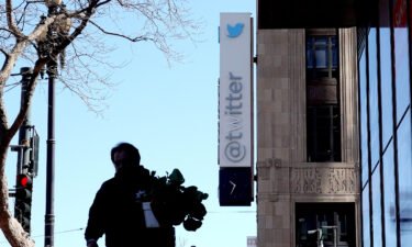 A modified company sign is posted on the exterior of the Twitter headquarters on April 10 in San Francisco