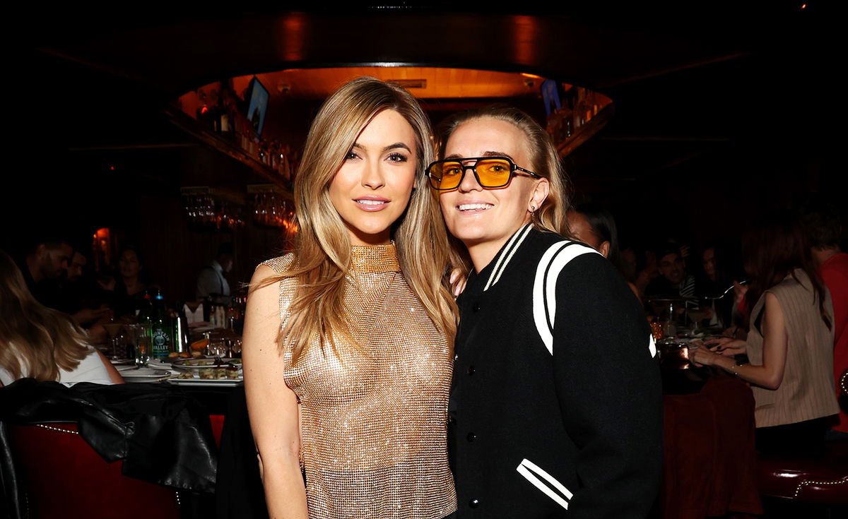 <i>Phillip Faraone/Getty Images</i><br/>Chrishell Stause (left) and G Flip attend Drake's Hollywood grand opening on May 4.