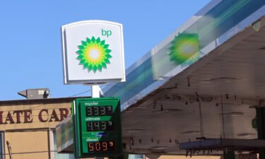Shares of BP fell Tuesday after a drop in its first-quarter profit. Pictured is a BP gas station in 2022 in New York.