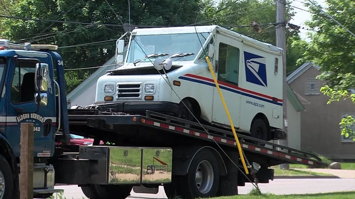 <i></i><br/>A USPS mail truck flips to its side in Waukesha