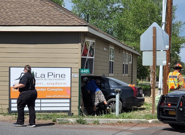 Car slammed into the John C. Johnson Building in La Pine Wednesday morning, which has housed temporary La Pine Library, Head Start classes