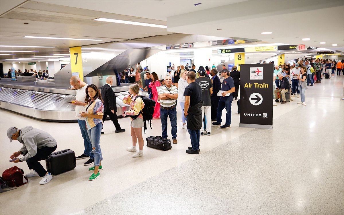 <i>Kena Betancur/Getty Images</i><br/>Individuals assemble and await the rescheduling of their flights at Newark International Airport on June 27 in Newark