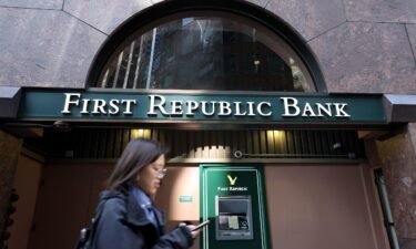 A pedestrian walks by a First Republic Bank office on March 16 in San Francisco