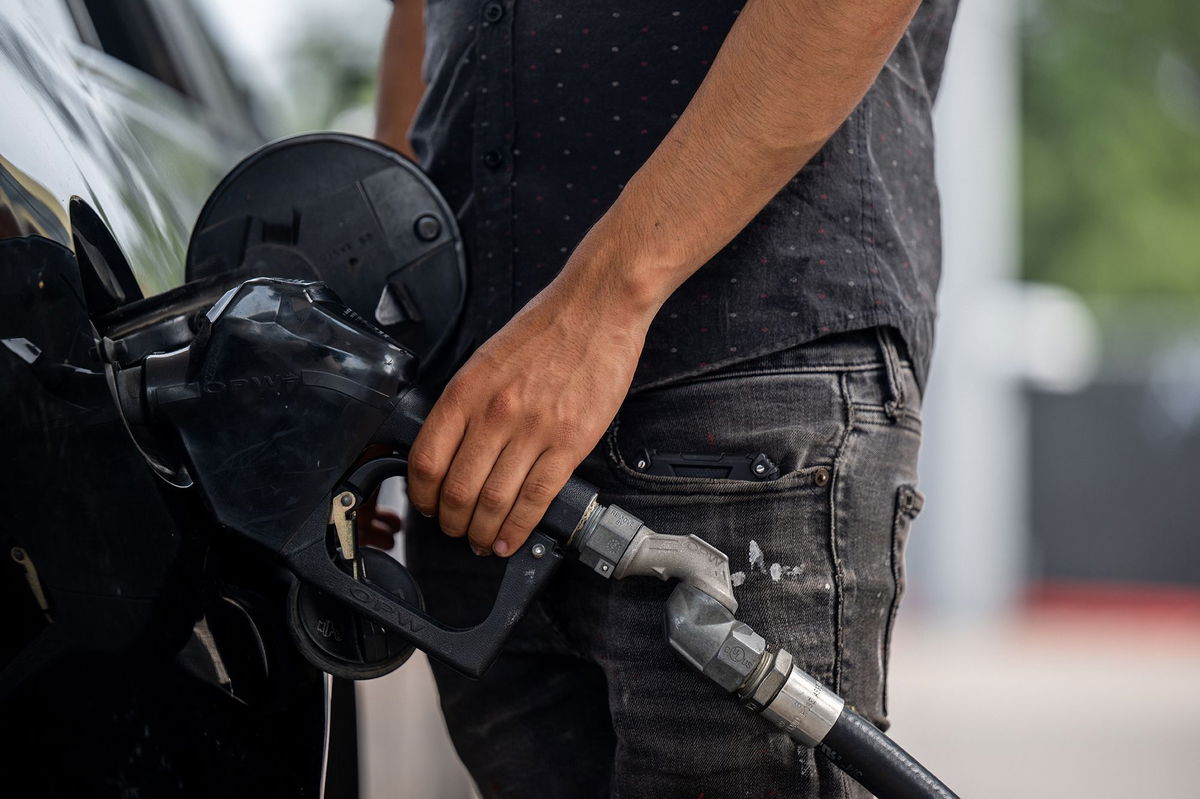 <i>Brandon Bell/Getty Images</i><br/>A person pumps gas at a Chevron gas station on May 26 in Austin