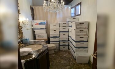 Boxes of classified documents are stored inside a bathroom and shower inside the Mar-a-Lago Club's Lake Room in this photo included in Donald Trump's federal indictment.
