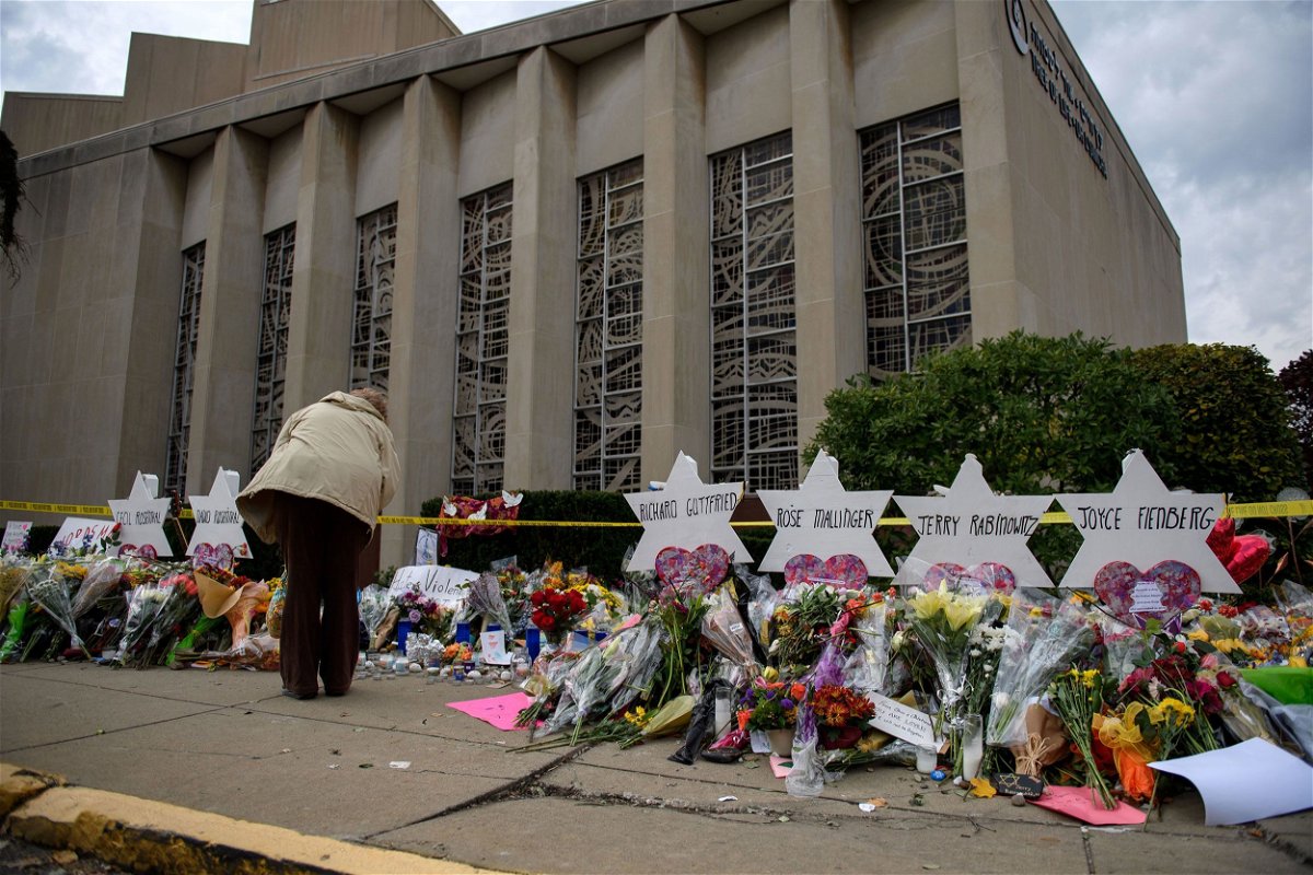 <i>Jeff Swensen/Getty Images/File</i><br/>Mourners visit the memorial outside the Tree of Life Synagogue on October 31