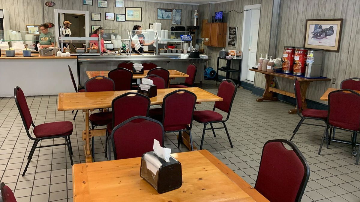 <i>Forrest Brown/CNN</i><br/>Staffers make last-minute preparations behind the buffet at Carolina Bar-B-Que in New Ellenton