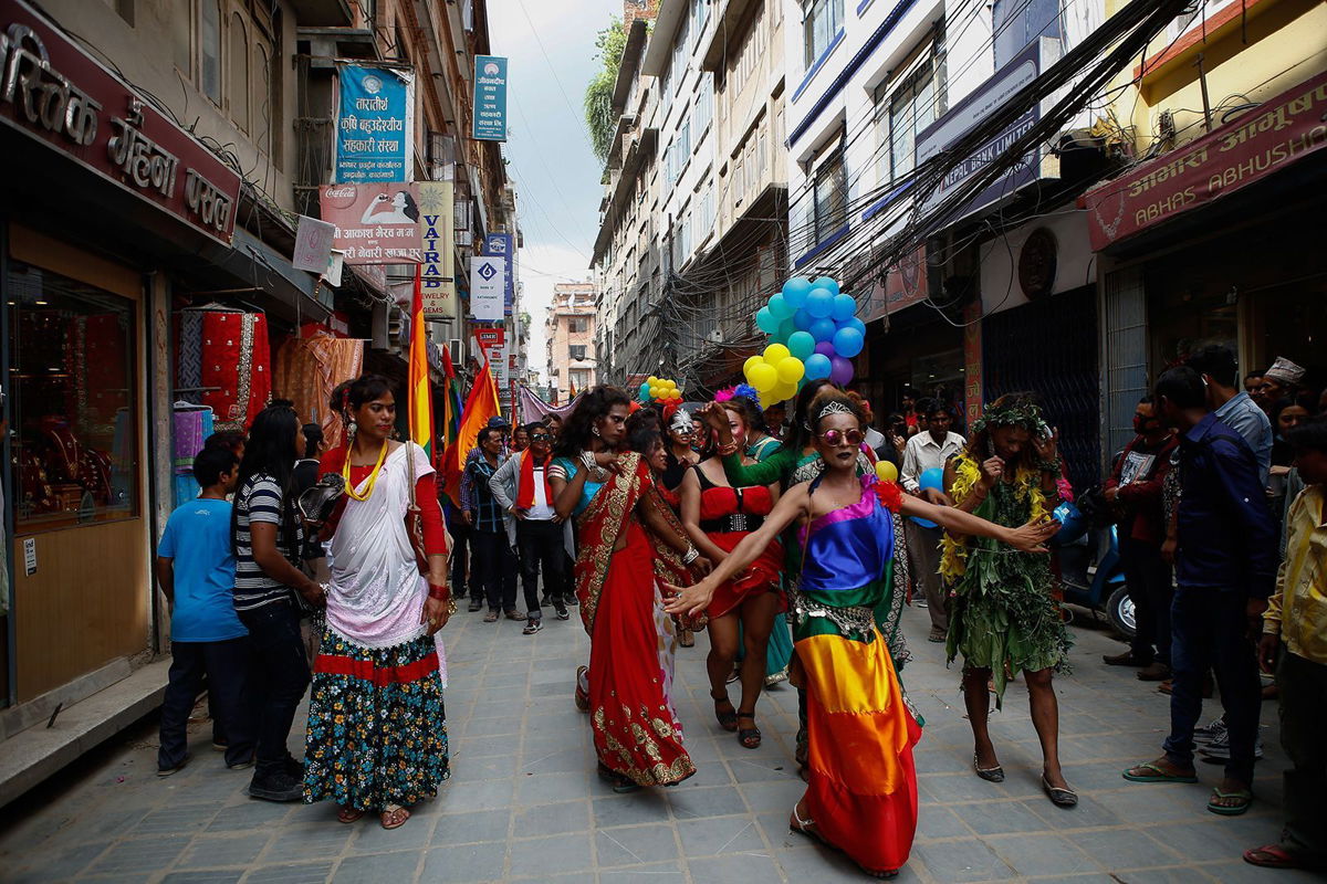 <i>Sunil Pradhan/Nurphoto/Getty Images</i><br/>People take part in a pride parade in Kathmandu in 2017.