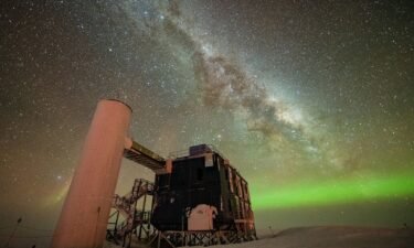 The IceCube detector is seen under a starry night sky