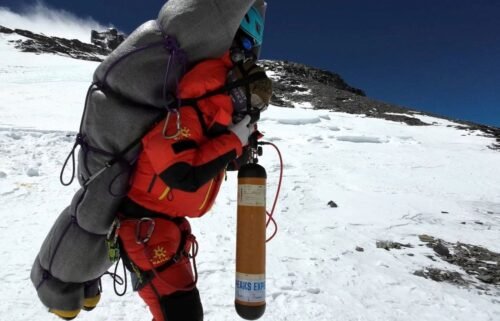 Ngima Tashi Sherpa carries a Malaysian climber from the death zone at Mount Everest on May 18.