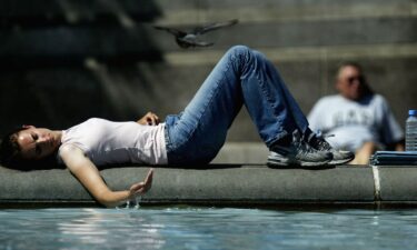 A girl cools off in July 2003 near a fountain in Trafalgar Square in London as a scorching heat wave hits Europe.