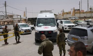 An ambulance leaves a military base following a deadly shootout in southern Israel along the Egyptian border on June 3.