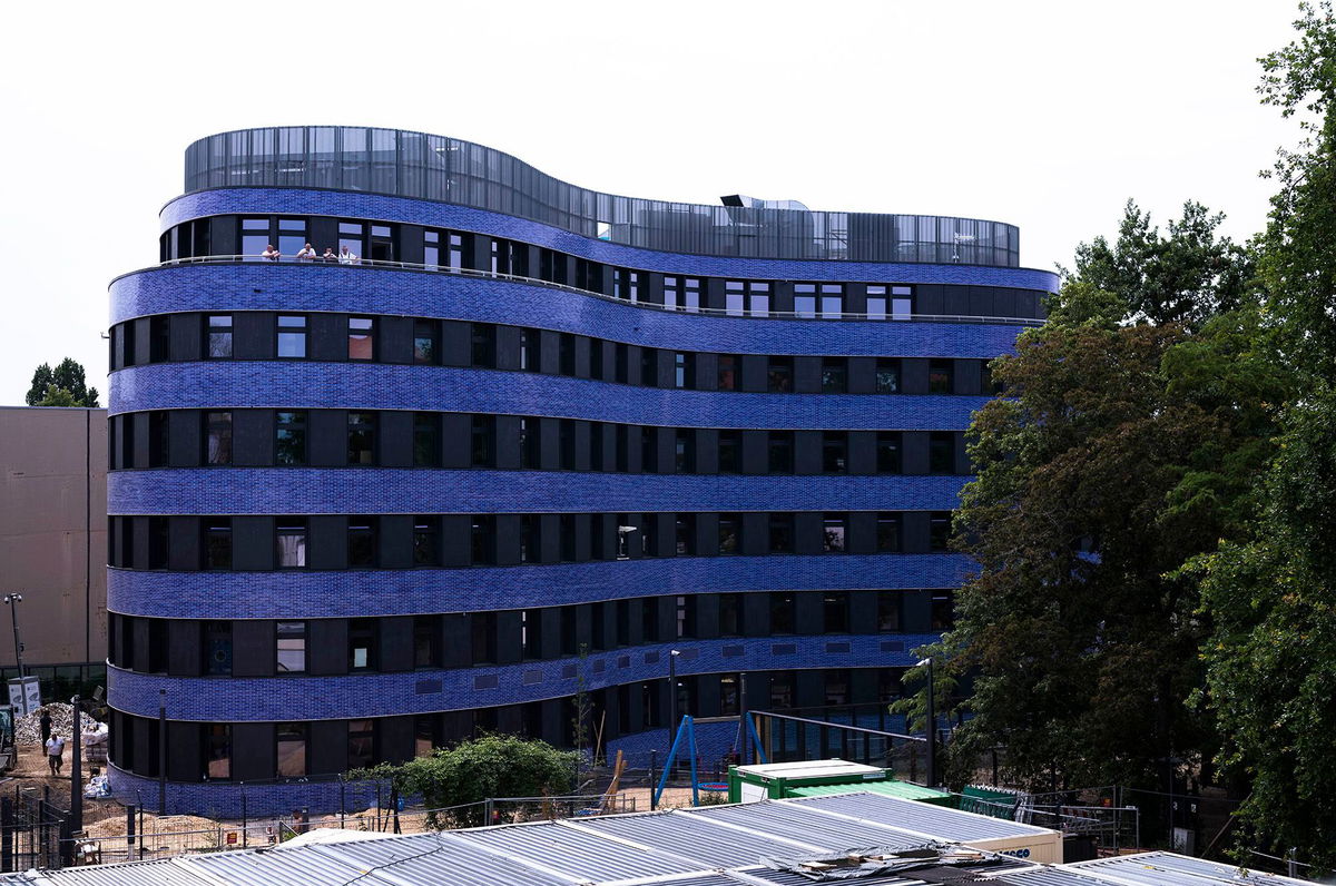 <i>Markus Schreiber/AP</i><br/>Blue tiles clad the curved building.