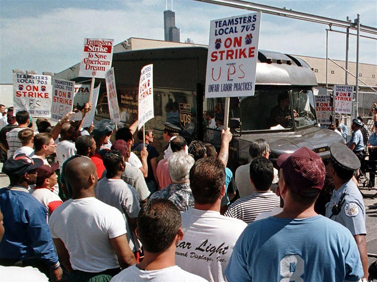 <i>Jeff Haynes/AFP/Getty Images/FILE</i><br/>Striking employees of UPS in Chicago in 1997