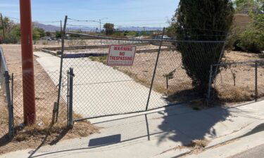 A fence lines an uneven foundation where a home once stood in the Windsor Park neighborhood of North Las Vegas.