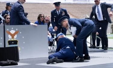 President Joe Biden is helped up after falling during the graduation ceremony at the United States Air Force Academy