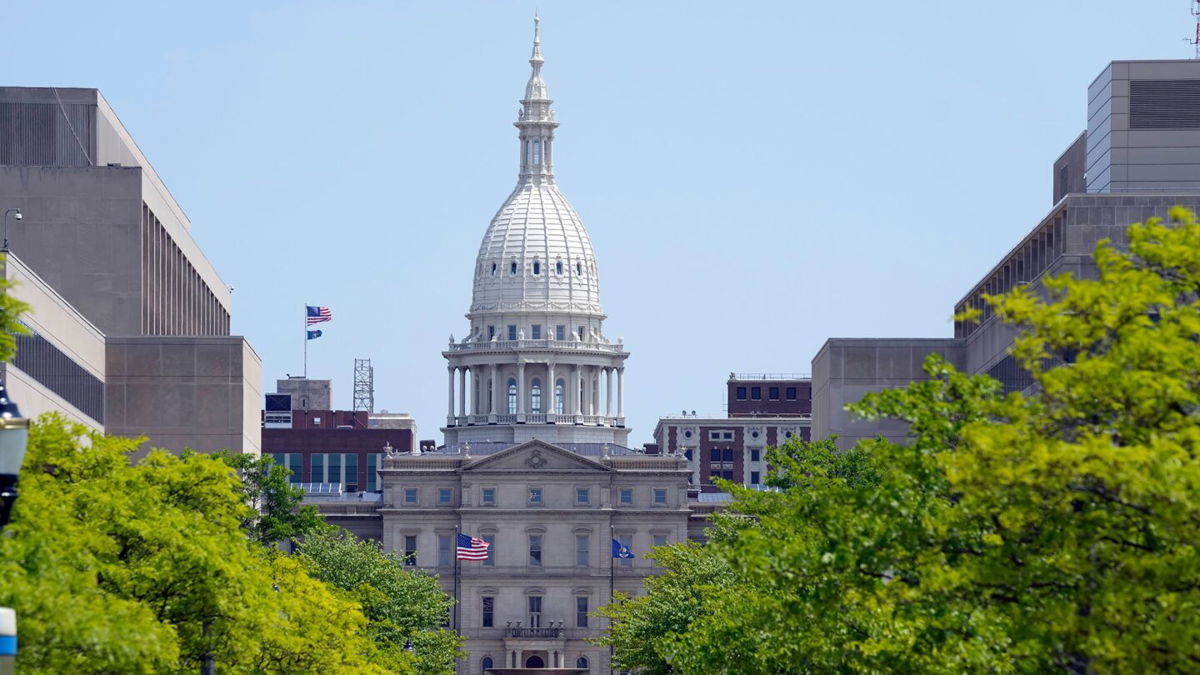 <i>Carlos Osorio/AP</i><br/>The Michigan State Capitol is photographed
