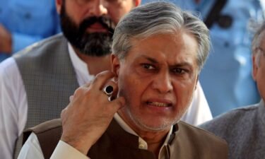 Pakistan's Finance Minister Ishaq Dar is seen after a meeting in Islamabad on September 26