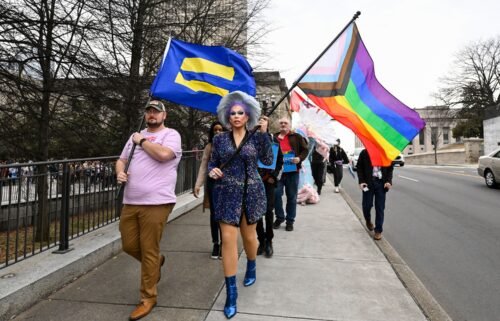 LGBTQ activists march past the Tennessee State Capitol in Nashville in February.