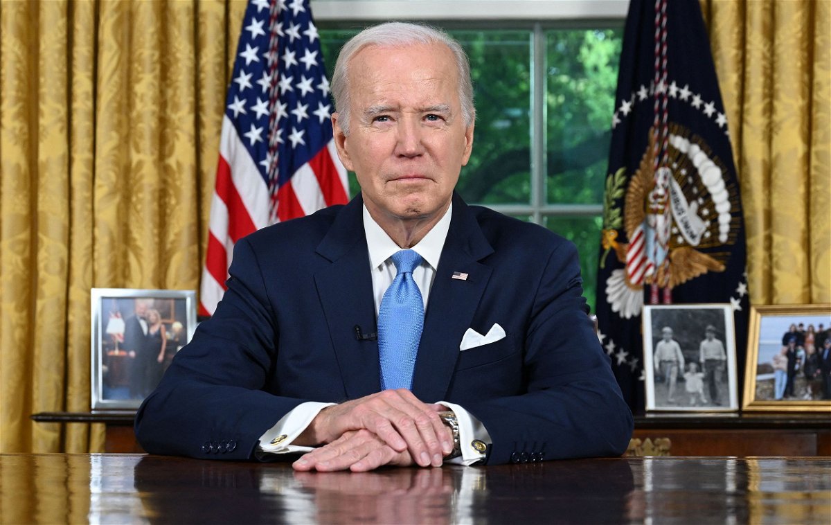 <i>Jim Watson/Pool/AFP/Getty Images</i><br/>President Joe Biden sits in the Oval Office ahead of addressing the nation on averting default and the Bipartisan Budget Agreement