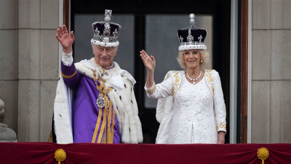 <i>Christopher Furlong/Getty Images</i><br/>King Charles III and Queen Camilla are seen on the Buckingham Palace balcony on May 6 in London