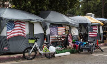Homeless veterans are housed in 30 tents on a sidewalk outside the Veteran's Administration campus on April 22