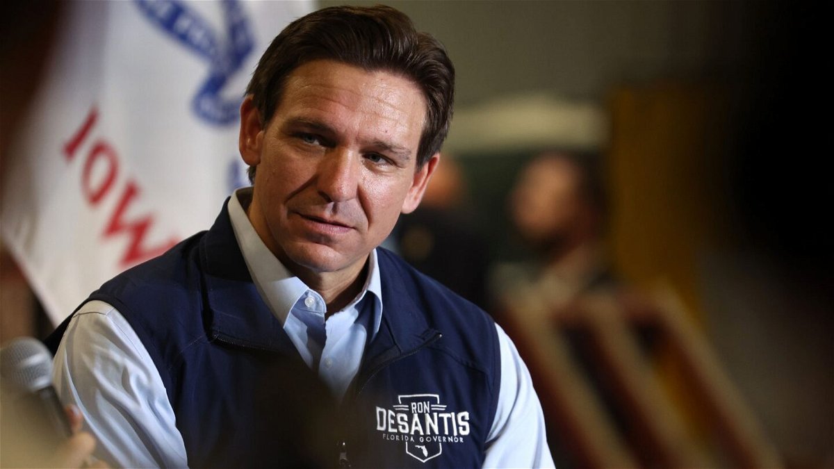 <i>Scott Olson/Getty Images</i><br/>Republican presidential candidate Florida Governor Ron DeSantis listens a his wife Casey speaks during a campaign rally at Port Neal Welding Company on May 31