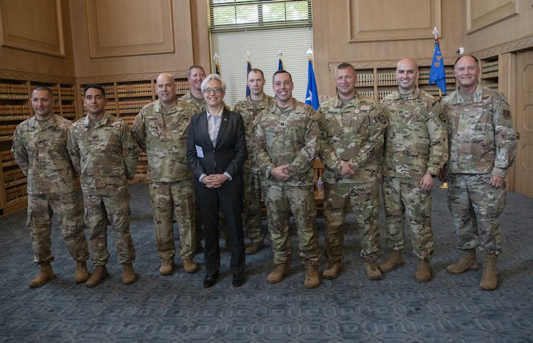 Governor Tina Kotek (center) and Maj. Gen. Michael Stencel, Adjutant General, Oregon (far right), pause for a group photo with members of the Oregon National Guard’s A (-) 641st Aviation at the conclusion of their mobilization ceremony held at the Oregon Capitol.
