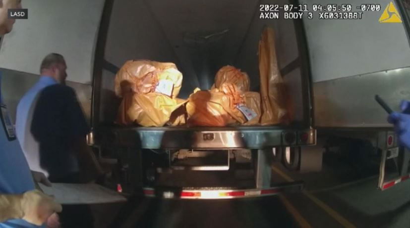 <i>LAPD/KCAL</i><br/>Bodycam footage has uncovered the moments following a multi-million dollar jewelry heist in Lebec.Brinks security guards are seen here opening the back of the semi-truck that stored the stolen jewelry.