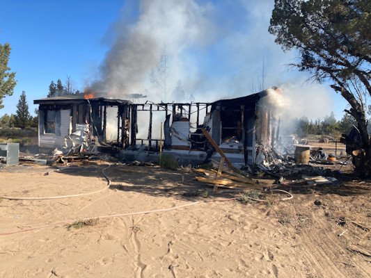 Flames engulfed home Wednesday in Juniper Acres subdivision