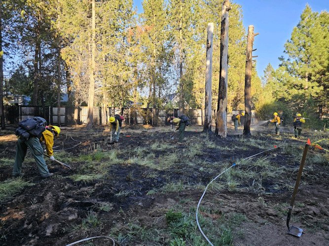 Crews were called out to stop a wildfire in La Pine on Saturday that authorities said was sparked by a firework