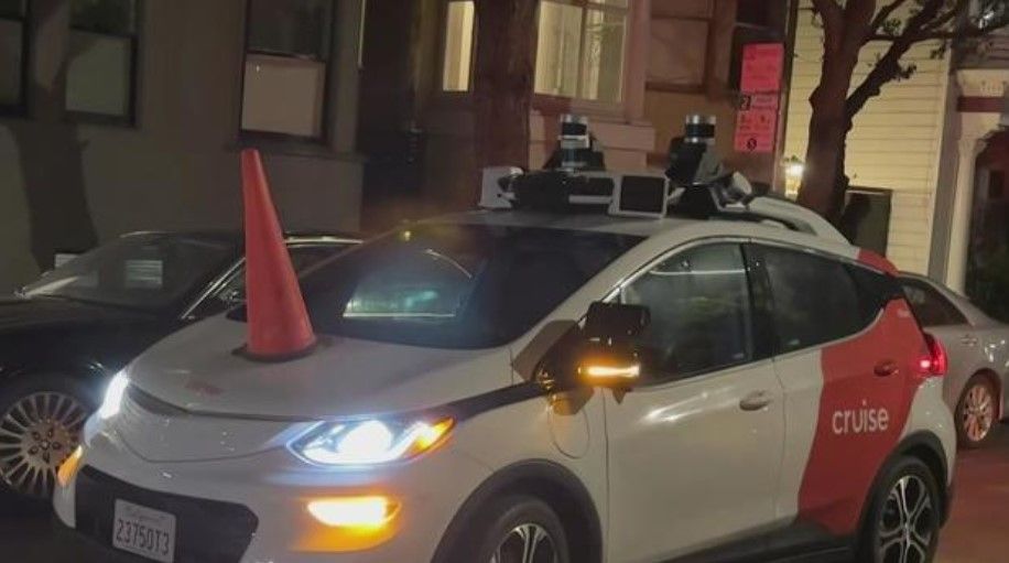 <i></i><br/>A robotaxi on a San Francisco street is disabled after a group of activists place an orange cone on the hood.