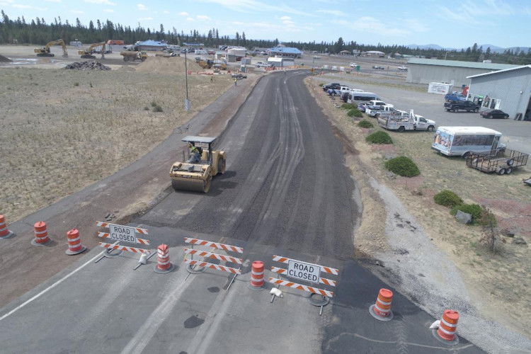 Aggregate base placement occurring on Rosland Road in La Pine