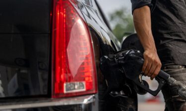 A person pumps gas at a Chevron gas station on May 26