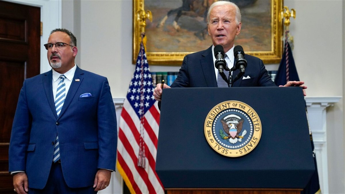 <i>Evan Vucci/AP</i><br/>President Joe Biden (right) speaks in the Roosevelt Room of the White House on June 30 after Supreme Court rulings issuing a major decision that impacts gay rights and striking down Biden's student loan forgiveness plan. Education Secretary Miguel Cardona listens at left.
