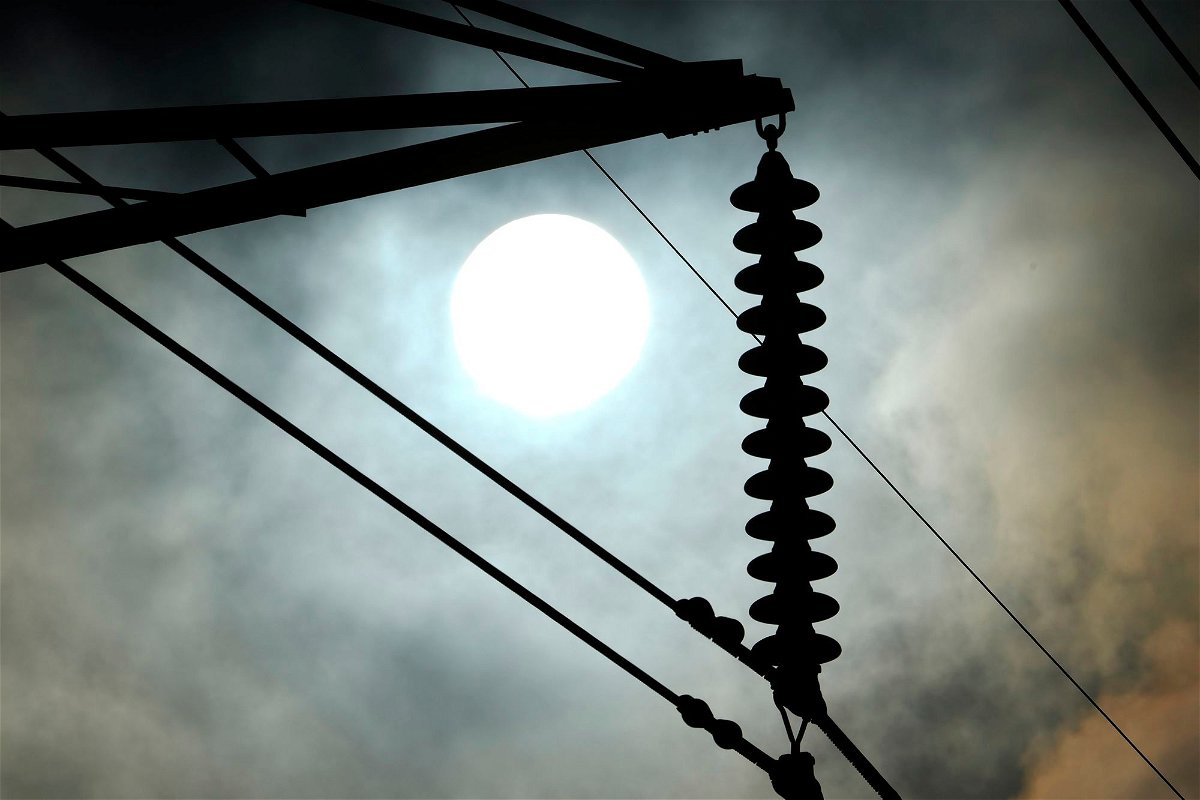 <i>David J. Phillip/AP</i><br/>Meteorologists say scorching temperatures brought on by a heat dome have taxed the Texas power grid and threaten to bring record highs to the state.