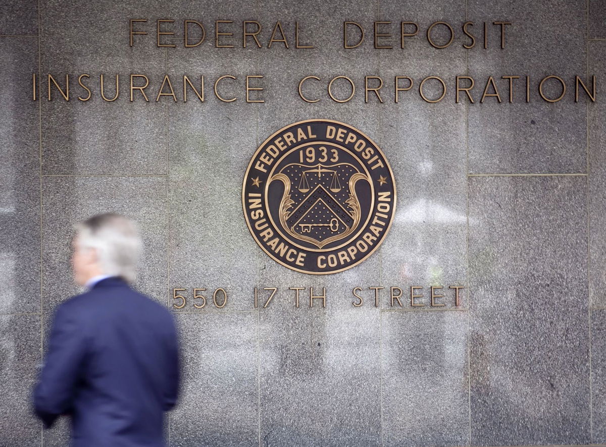 <i>Brendan Hoffman/Bloomberg/Getty Images</i><br/>A pedestrian walks outside the headquarters of the U.S. Federal Deposit Insurance Corp.