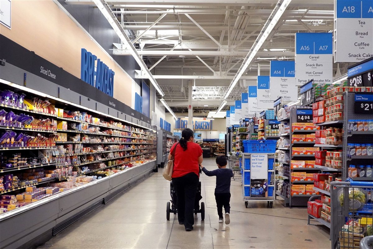 <i>Scott Olson/Getty Images</i><br/>Customers shop at a Walmart store on May 18 in Chicago