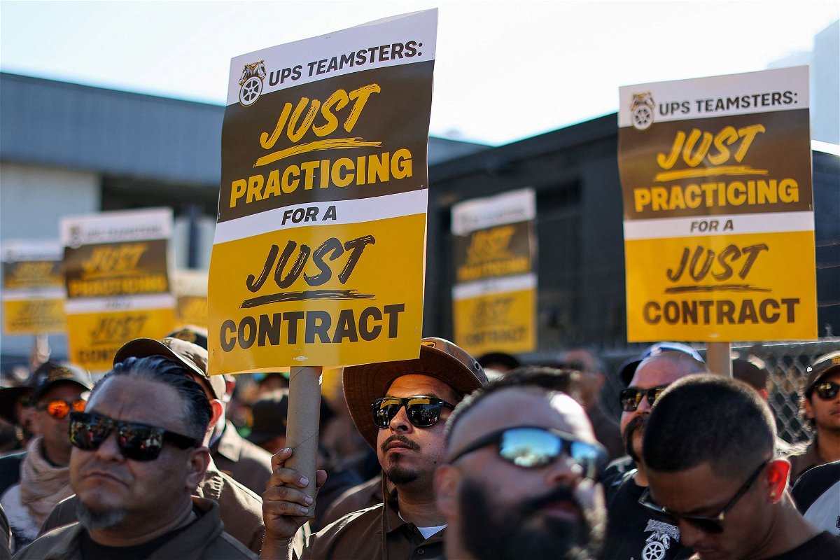 <i>Mike Blake/Reuters</i><br/>UPS and the Teamsters have reached a tentative deal on a new contract. UPS teamsters here hold a rally outside a UPS facility in Los Angeles