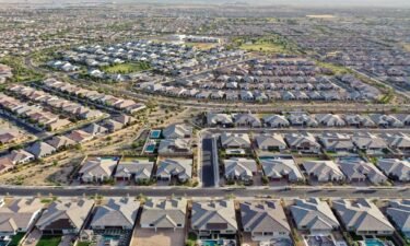 Middle-income Americans think prosperity is within reach. Pictured is an aerial view of homes in the Phoenix suburbs on June 9