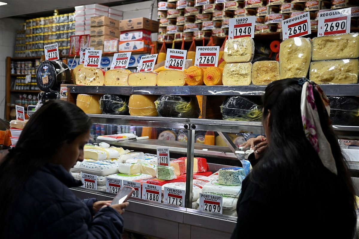 <i>Luis Robayo/AFP/Getty Images</i><br/>Women buy cheese in a stall at the Central Market in Buenos Aires
