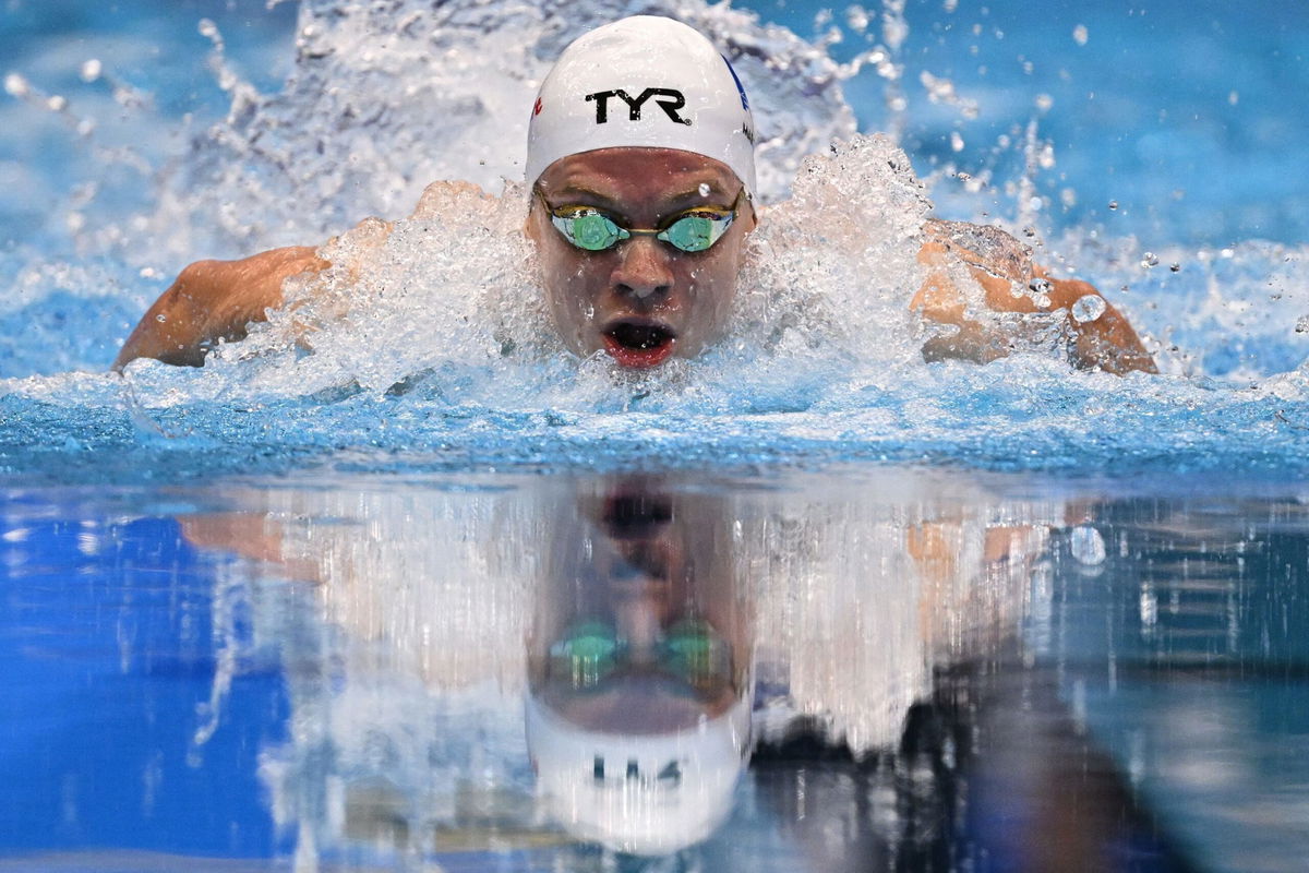 <i>Manan Vatsyayana/AFP/Getty Images</i><br/>France's Leon Marchand competes in the final of the men's 400m medley.