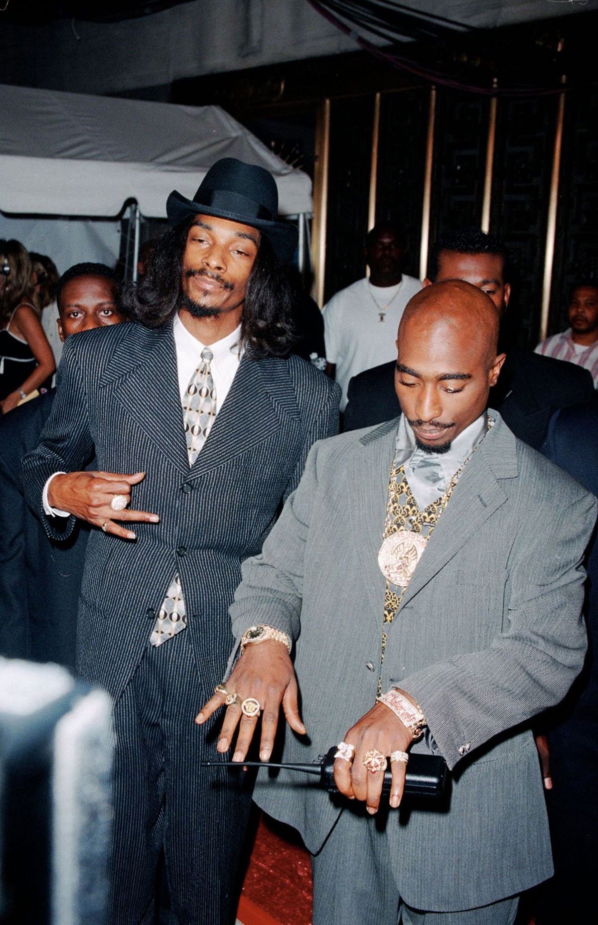 <i>DMI/The LIFE Picture Collection//Shutterstock</i><br/>From left: Snoop Doggy Dogg and Tupac Shakur show off their rings