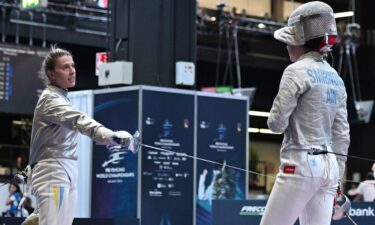 Kharlan offers Smirnova her sabre during their world championships match.