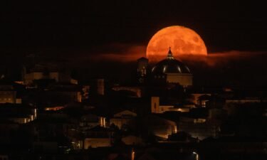 The sturgeon supermoon rises behind the Basilica of San Bernardino in L'Aquila in Italy's Abruzzo region