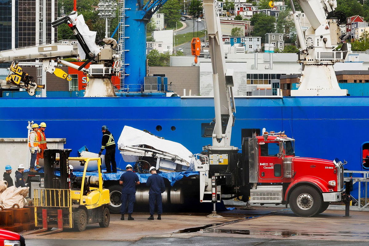 <i>David Hiscock/Reuters</i><br/>Salvaged pieces of the Titan submersible from OceanGate Expeditions arrive in St. John's