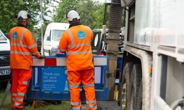Thames Water employees fixing leaking pipes in Windsor