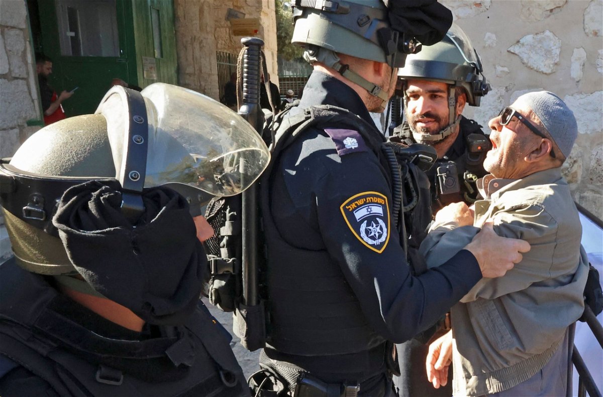 <i>Hazem Bader/AFP/Getty Images</i><br/>Israeli security forces scuffle with a Palestinian man as he tries to enter the al-Aqsa mosque compound to attend  Friday prayers on April 15