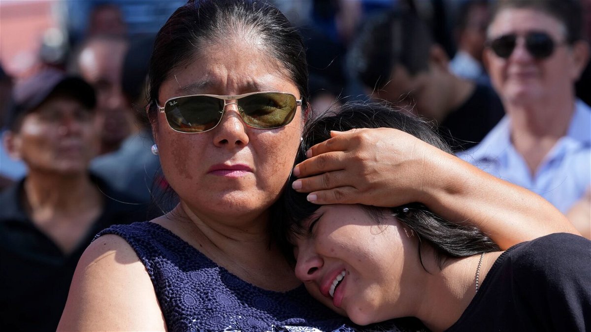 <i>Dolores Ochoa/AP</i><br/>Mourners cry during the funeral of Agustin Intriago in Manta